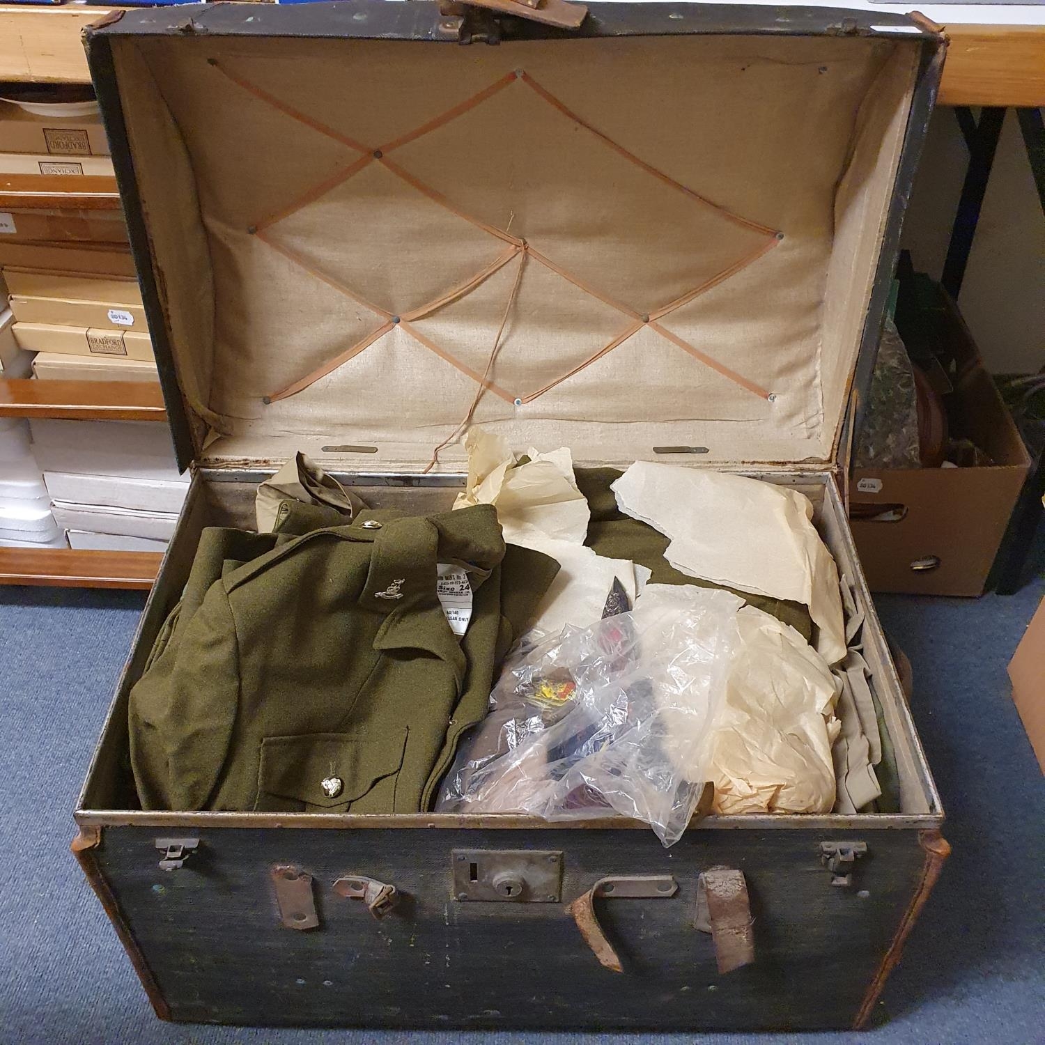 Assorted Queen Elizabeth II military uniforms, including a No II dress, in a dome top travelling