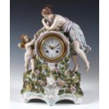 A late 19th century mantel clock, the 8 cm diameter enamel dial with Roman numerals, fitted an eight