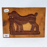 A treen gingerbread mould, 28 cm wide