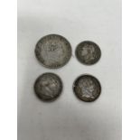 A George III half crown, 1819, and three George III shillings (4)