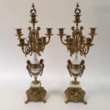 A pair of Victorian style gilt metal seven light candelabra, from a clock garniture, 68 cm high (2)