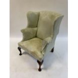 A George III style wing armchair