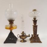 An oil lamp, with a clear glass well, 56 cm, an oil lamp in the form of a genie's lamp, 39 cm