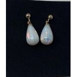 A pair of 9ct gold and opal drop earrings