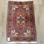 A Persian Heriz rug, 103 x 72 cm