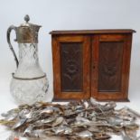 A silver plated and cut glass claret jug, a collection of commemorative spoons, and other items (