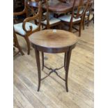 An early 20th century mahogany oval table, on splayed legs united by an X stretcher, 47 cm wide