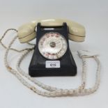 A Bakelite dial telephone, with a white handle Prop phone