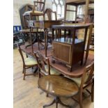 A mahogany extending dining table, inset an extra leaf 208 cm wide, six matching chairs, a