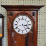 A Regulator style wall clock, the 16.5 cm enamel dial with Roman numerals, in a stained wood case,