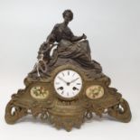 A late Victorian mantel clock, the 8 cm diameter enamel dial with Roman numerals, in a spelter