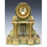A late Victorian mantel clock, the 10 cm diameter brass chapter ring with Arabic numerals, with