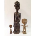 An African carved sculpture, of a mother and baby, 92 cm high and a carved African panel 96 x 47