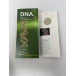 A Brilliant Uncirculated DNA £2 coin, and others similar