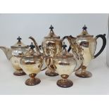 A silver plated entree dish, a four piece tea service and other silver plate (qty)