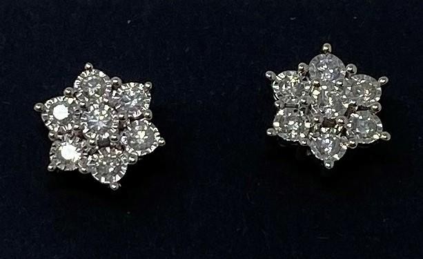 A pair of 9ct gold and diamond daisy earrings