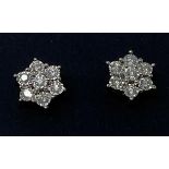 A pair of 9ct gold and diamond daisy earrings
