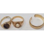 A 9ct gold wedding band, cut, and two other 9ct gold rings total weight three rings 11.3g