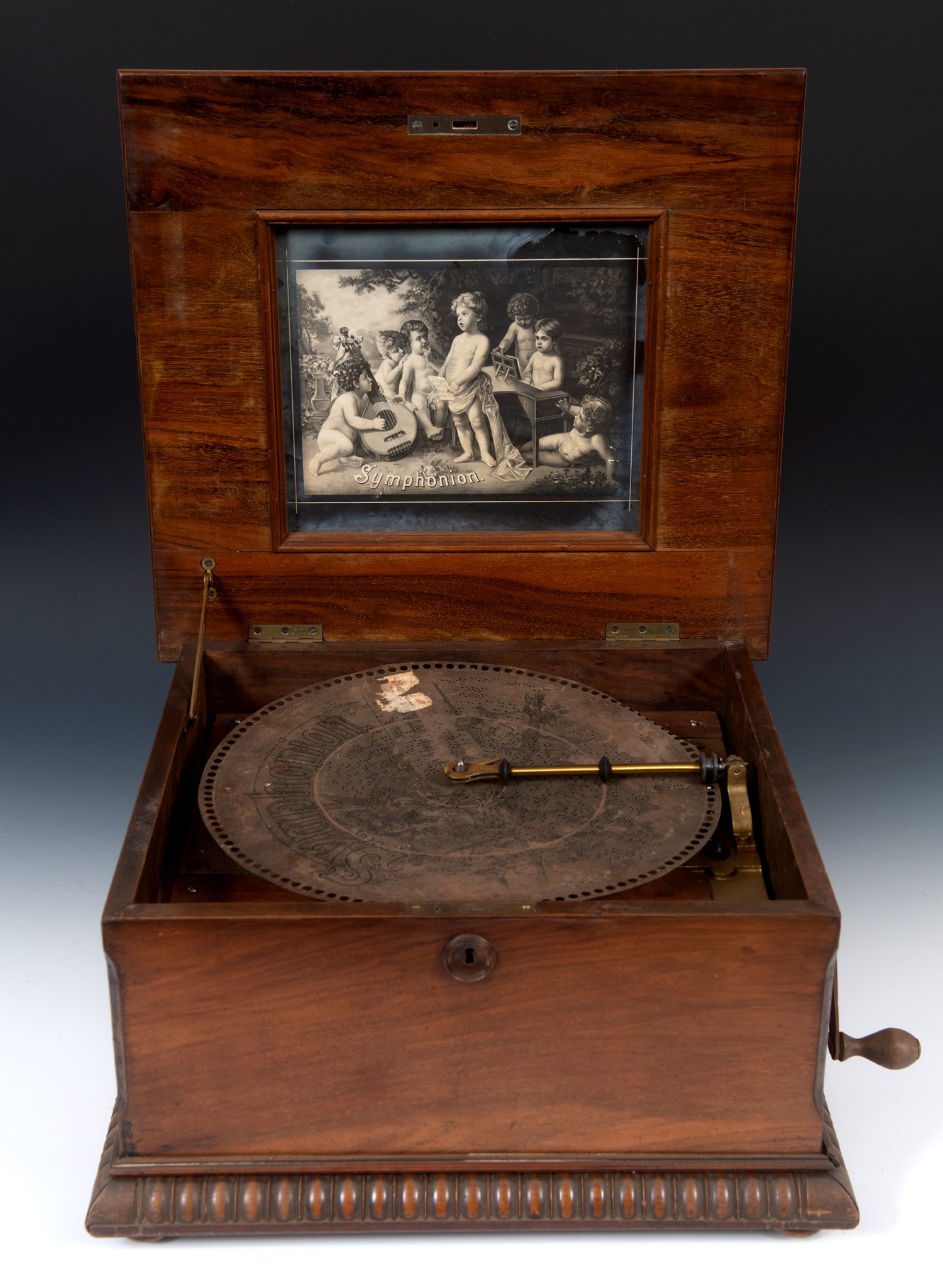 A late 19th century table top Symphonion, playing 33.5 cm diameter disc, in a walnut case, 45 cm