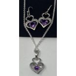 A pair of silver, amethyst and diamond set earrings, and a matching necklace This is a modern copy