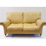 A Wesley Barrell Victorian style two seater settee, on turned front legs