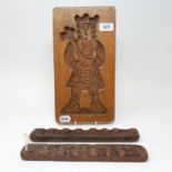 A treen gingerbread mould, 33 cm and two others (3)