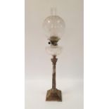 An oil lamp, with an acid etched glass shade, clear glass well and silver plated base in the form of