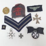 An Order of St John neck badge, a breast badge, and a small group of militaria items