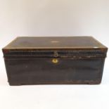 A 19th century leather and brass bound travelling trunk, with studwork decoration. 94 cm wide