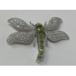 A silver and peridot dragonfly brooch This is a modern copy