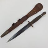 A Fairbairn & Sykes type Commando fighting knife, with a ribbed handle, and a leather scabbard