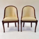 A pair of 19th century mahogany hoop back chairs, of small proportions, on cabriole legs (2) Signs