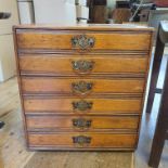 An oak filing chest, having six drawers, 44 cm wide, a wine table and a stool (3)