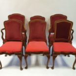 A set of six oak dining chairs, with padded backs and seats on cabriole legs (4+2)
