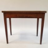 A 19th century mahogany folding tea table, on square tapering legs, 86 cm wide