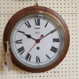 A ships bulkhead type clock, the 18.5 cm diameter painted dial signed Smiths Astral, in a brass