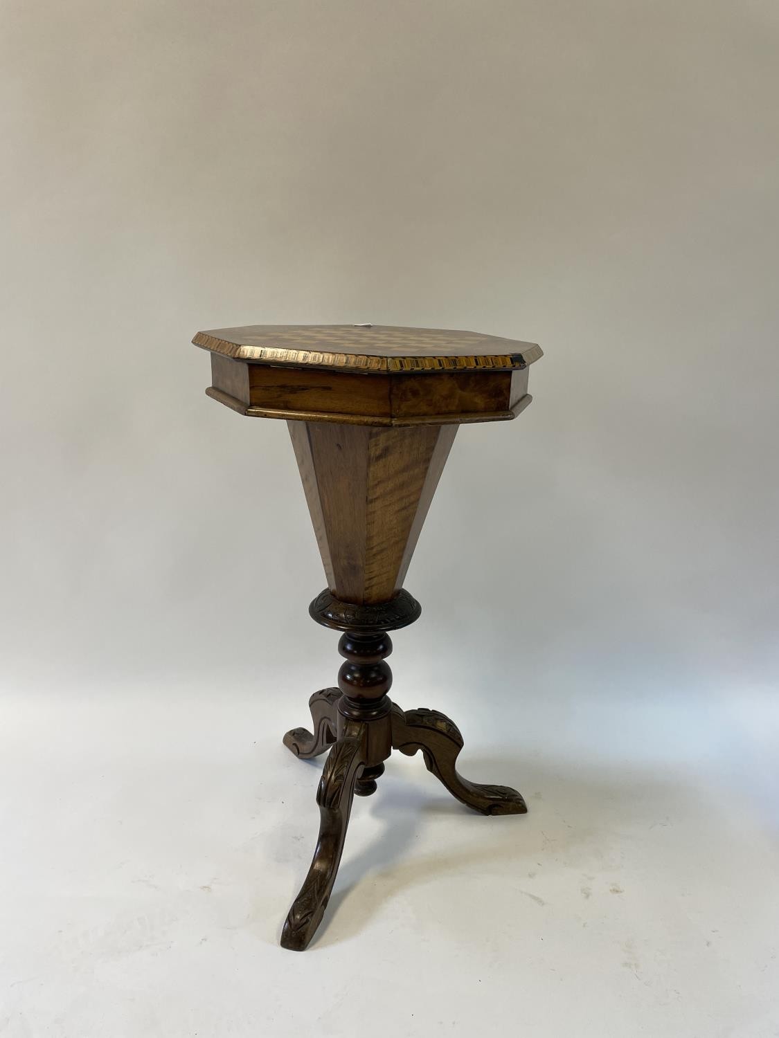 A 19th century walnut work table, the top inlaid for chess, 44 cm wide