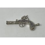 A modern silver whistle, in the form of a pistol This is a modern copy