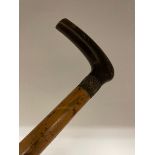 A walking stick, with a horn handle, 88 cm long and four others (5)