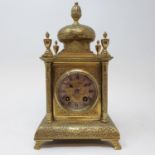 A mantel clock, the 6 cm diameter silvered chapter ring with Roman numerals fitted an eight day