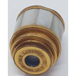 A late 19th/early 20th century French monocular, with a brass and mother of pearl case, by