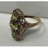 A 9ct gold, peridot and pearl ring