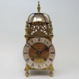 A 17th century style lantern clock, the 11.5 cm diameter silvered chapter ring with Roman