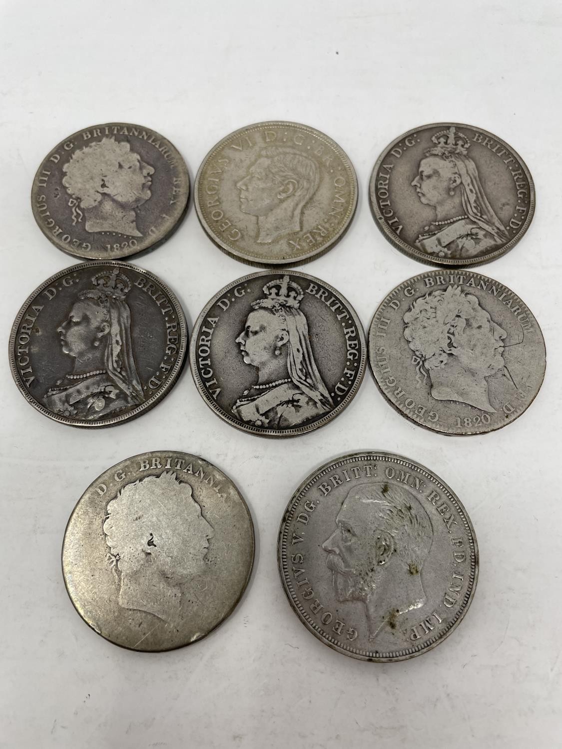 A George III crown, 1820, and seven other crowns (8)