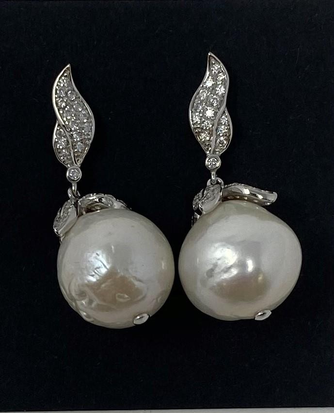 A pair of silver baroque style pearl earrings