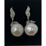 A pair of silver baroque style pearl earrings