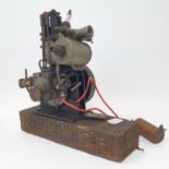 A small single cylinder petrol engine, with a pulley wheel, possibly for powering a toy motor
