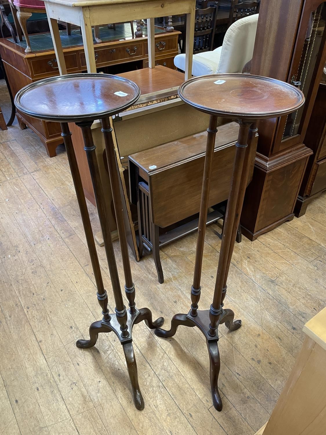 A pair of mahogany pedestals, 108 cm high, a Canterbury, a Sutherland table, a coffee table, and two