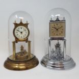 A 400 day brass clock, under a glass dome, 28 cm high and another similar (2)