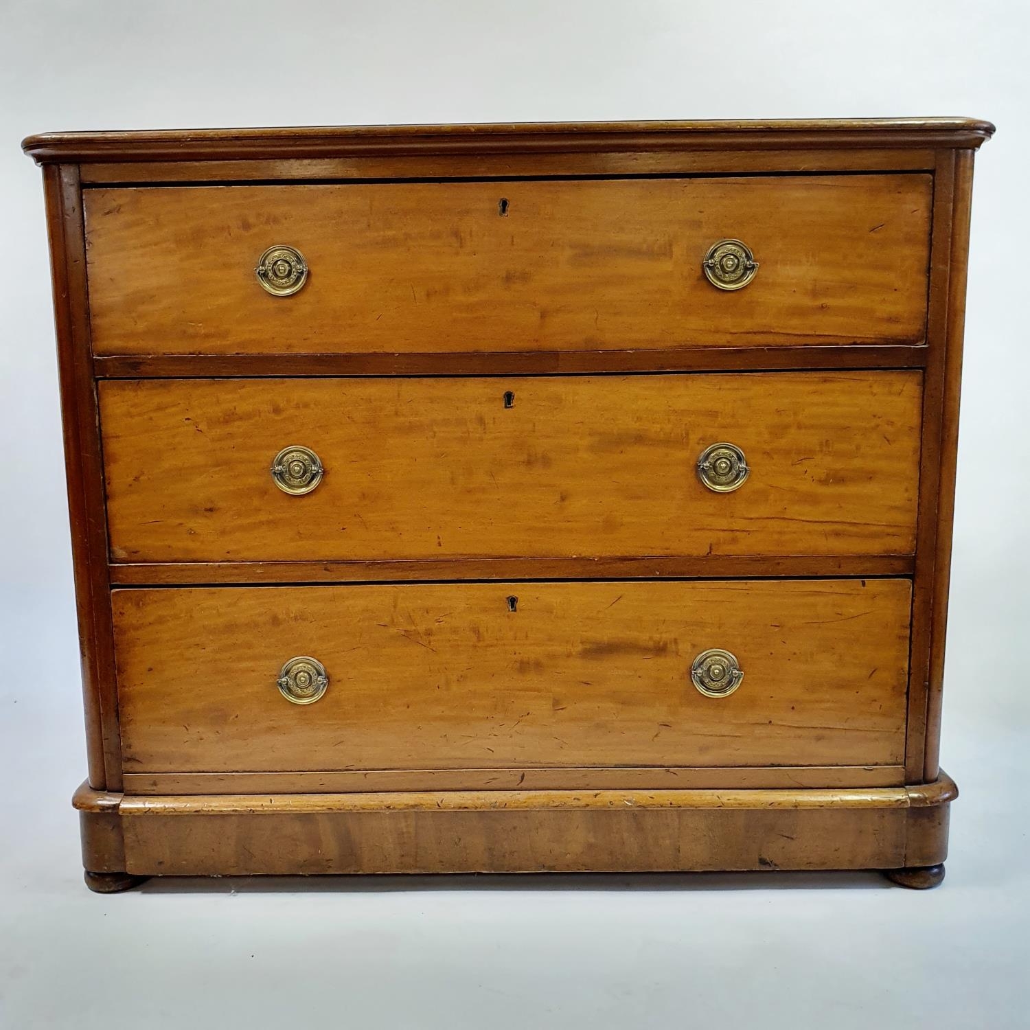 A 19th century mahogany chest, having three long drawers, 104 cm wide